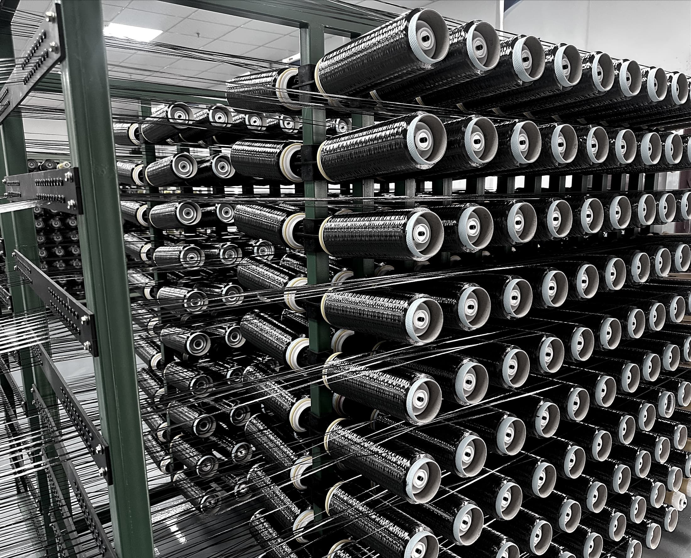 Carbon fiber yarn creel prepared for fabric production at FRP HOME